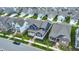 A street view of homes with beautifully landscaped lawns, sidewalks, and various architectural styles in a residential community at 1364 Chatham Hills Blvd, Westfield, IN 46074