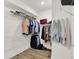 Walk-in closet featuring shelving, clothing rods, and wood-look vinyl flooring at 1364 Chatham Hills Blvd, Westfield, IN 46074