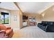 Cozy finished basement with plush carpeting, a TV area, and large windows for natural light at 14711 Macduff Dr, Noblesville, IN 46062