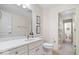 Bright bathroom featuring double vanity and a separate room for the toilet and shower at 14711 Macduff Dr, Noblesville, IN 46062