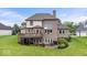 Back exterior of home with brick, deck, and patio at 14711 Macduff Dr, Noblesville, IN 46062