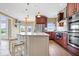 Spacious kitchen with a large center island, stainless steel appliances, and pendant lighting at 14711 Macduff Dr, Noblesville, IN 46062