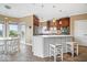 Modern kitchen with stainless steel appliances, sleek countertops, and breakfast bar seating offers a perfect spot for casual dining at 14711 Macduff Dr, Noblesville, IN 46062