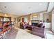Finished living room with wet bar, fireplace, and comfortable seating arrangements at 14711 Macduff Dr, Noblesville, IN 46062
