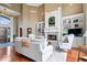 Comfortable living room boasts a fireplace, built-in bookshelves, and lots of natural light at 14711 Macduff Dr, Noblesville, IN 46062