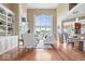 Open-concept living room with hardwood floors, fireplace, and access to the dining area at 14711 Macduff Dr, Noblesville, IN 46062