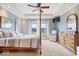Spacious main bedroom featuring a large bed, dresser, and windows overlooking the backyard at 14711 Macduff Dr, Noblesville, IN 46062