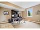 Home office featuring desk, chair, built in shelving, and natural light from a large window at 14711 Macduff Dr, Noblesville, IN 46062
