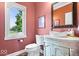 Charming powder room with decorative vanity, vessel sink, and window at 14711 Macduff Dr, Noblesville, IN 46062
