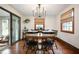 Elegant dining room with hardwood floors, a chandelier, and a sliding glass door at 1495 E 240 N, Anderson, IN 46012