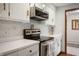 Modern kitchen with white cabinets, stainless steel appliances, and a clean, functional design at 1495 E 240 N, Anderson, IN 46012