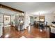 Open kitchen and dining area with stainless steel appliances, hardwood floors, and ample natural light at 1495 E 240 N, Anderson, IN 46012