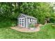 Backyard showing a shed with nice landscaping and play area behind at 1513 Alimingo Dr, Indianapolis, IN 46260