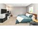 Cozy bedroom with plush carpeting, a large bed, and a comfortable workspace at 1513 Alimingo Dr, Indianapolis, IN 46260