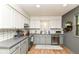 Modern kitchen with stainless steel appliances, ample cabinets, and stylish countertops at 1513 Alimingo Dr, Indianapolis, IN 46260