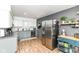 Well-lit kitchen with stainless steel appliances, ample counter space, and stylish accents at 1513 Alimingo Dr, Indianapolis, IN 46260
