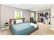 Spacious main bedroom featuring a walk-in closet and relaxing natural light from two windows at 1513 Alimingo Dr, Indianapolis, IN 46260