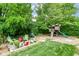 Backyard featuring a play area with chairs surrounding a fire pit at 1513 Alimingo Dr, Indianapolis, IN 46260