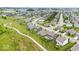 The aerial shot showcases a sprawling community with interconnected pathways, lush greenery, and a tranquil pond at 1539 Hazy Falls Blvd, Westfield, IN 46074