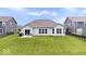 Green backyard with patio furniture, perfect for outdoor entertaining and relaxation at 1539 Hazy Falls Blvd, Westfield, IN 46074