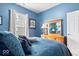 Inviting bedroom featuring a dresser with a vintage mirror and a luxurious bed with plush bedding at 1539 Hazy Falls Blvd, Westfield, IN 46074