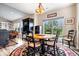 Cozy breakfast nook with round table, four chairs, and a sliding glass door leading to the backyard at 1539 Hazy Falls Blvd, Westfield, IN 46074