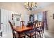 Dining room features a wood table, six chairs, and an open doorway with natural lighting at 1539 Hazy Falls Blvd, Westfield, IN 46074