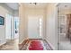Foyer featuring a decorative rug, light hardwood floors, and natural light streaming through the front door at 1539 Hazy Falls Blvd, Westfield, IN 46074