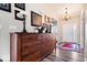 Foyer featuring light hardwood floors, and a traditional wooden dresser with decor and artwork on display at 1539 Hazy Falls Blvd, Westfield, IN 46074