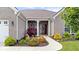 Close up of the front entrance with a beautiful landscape garden and walkway leading up to the front door at 1539 Hazy Falls Blvd, Westfield, IN 46074
