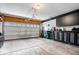 Well-lit garage featuring an automatic door, storage solutions, and a clean, organized space at 1539 Hazy Falls Blvd, Westfield, IN 46074