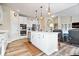 Open kitchen design with island seating and seamless flow into the living area at 1539 Hazy Falls Blvd, Westfield, IN 46074