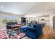 Open-concept living area with large windows, vaulted ceilings, and modern furnishings at 1539 Hazy Falls Blvd, Westfield, IN 46074