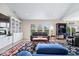 Cozy living room featuring built-in bookshelves, large windows, and comfortable seating on a decorative rug at 1539 Hazy Falls Blvd, Westfield, IN 46074