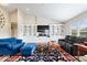 Spacious living room featuring custom built-ins, lots of natural light, and comfortable seating at 1539 Hazy Falls Blvd, Westfield, IN 46074