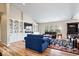 Bright living room featuring built-in shelving, a television, and large windows at 1539 Hazy Falls Blvd, Westfield, IN 46074