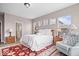 Comfortable main bedroom with a chair, multiple windows, and lamps at 1539 Hazy Falls Blvd, Westfield, IN 46074