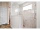 Modern walk-in shower with glass enclosure and built-in bench at 1539 Hazy Falls Blvd, Westfield, IN 46074