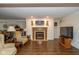 Cozy basement area featuring a classic fireplace, comfortable seating, and a modern television setup at 16126 Hymera Green, Westfield, IN 46074