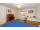 Bright bedroom with two twin beds and a vintage dresser, filled with natural light from the egress window at 16126 Hymera Green, Westfield, IN 46074