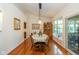 Elegant dining room with hardwood floors, natural light, and a dining table with seating for six at 16126 Hymera Green, Westfield, IN 46074