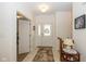 Bright foyer featuring a glass-paneled front door, tiled floors, and a warm, welcoming atmosphere at 16126 Hymera Green, Westfield, IN 46074