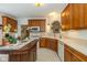 Well-equipped kitchen with wooden cabinets, modern appliances, and a center island at 16126 Hymera Green, Westfield, IN 46074