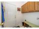 A practical mudroom features a door, storage cabinets, and a bench with a space to store shoes at 16126 Hymera Green, Westfield, IN 46074