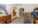 Cozy office space featuring wood furniture, a built-in bookshelf, and an open view to the house's interior at 16126 Hymera Green, Westfield, IN 46074