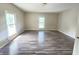 Large bedroom features hardwood floors and plenty of natural light at 1706 Reverend J.T. Menifee St, Anderson, IN 46016
