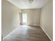 This bedroom features hardwood floors and a window, ready for your personal touch at 1706 Reverend J.T. Menifee St, Anderson, IN 46016