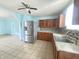 Galley kitchen features granite countertops and a stainless steel refrigerator at 1706 Reverend J.T. Menifee St, Anderson, IN 46016