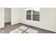 Bedroom featuring window with natural light, neutral carpeting, and closet at 19450 Northwest Dr, Westfield, IN 46074