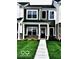 Charming two-story home with black shutters, well-maintained lawn, and front walkway at 19450 Northwest Dr, Westfield, IN 46074